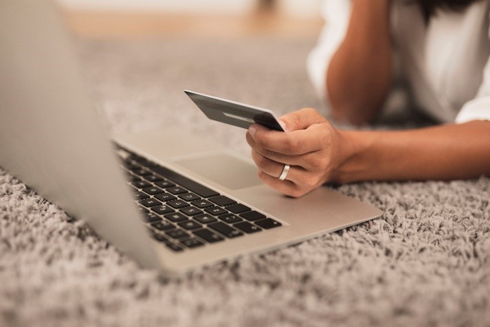 Woman online shopping to depict ecommerce features