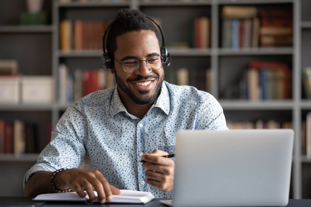 Subscription consumer looking at laptop.