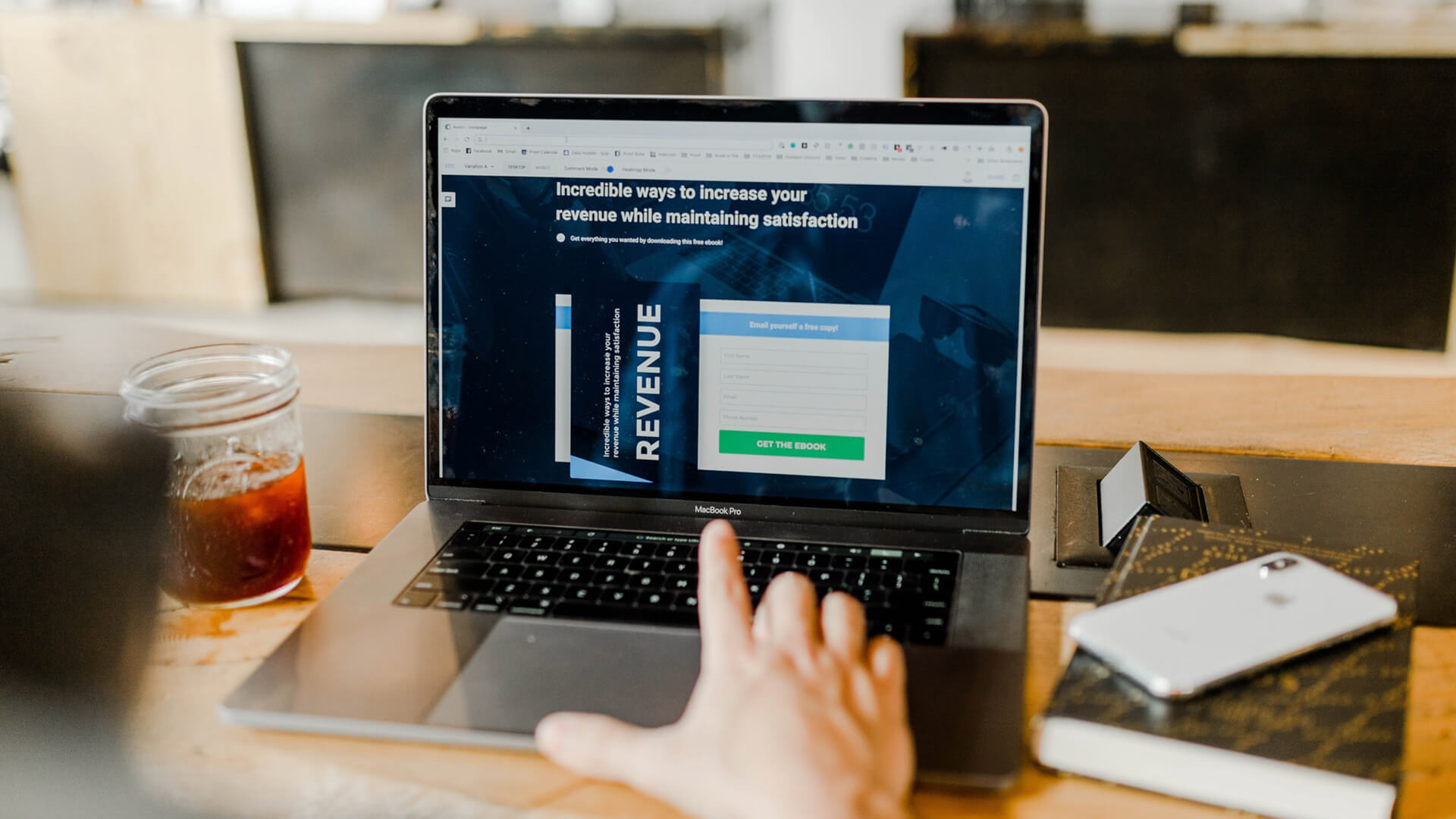 Merchant on computer calculating monthly recurring revenue