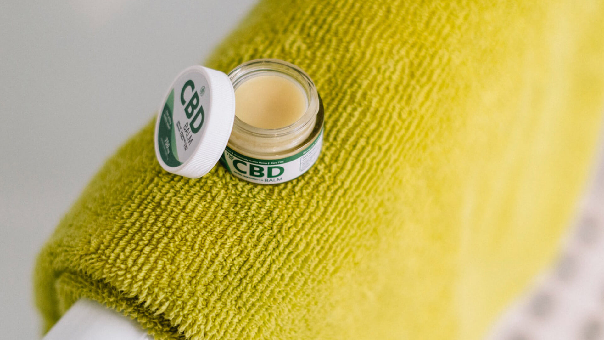 CBD online retail product in a lotion container